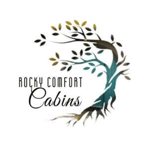A tree with leaves and the words rocky comfort cabins.