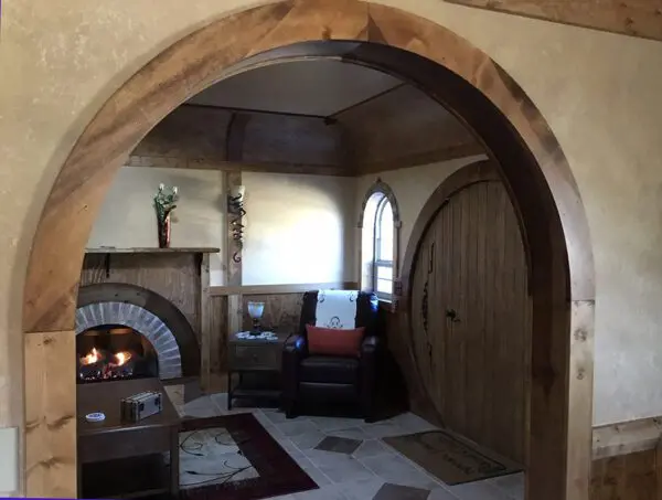 A living room with a fireplace and a couch
